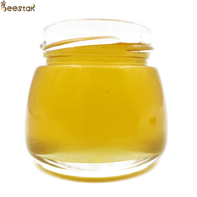 comprar Mel cru puro Natureza Mel de flor de madeira de fruto Sem viciante Cor amarelo brilhante 100% Mel de abelha natural fabricação em linha