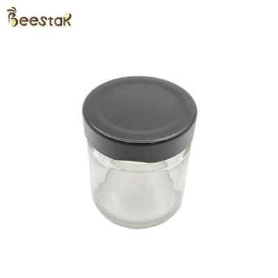 comprar garrafa de 250ml Honey Jar And Spoon Glass para Honey Packaging fabricação em linha